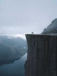 Preview wallpaper silhouettes, rock, cliff, lake, mist