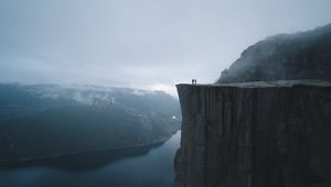 Preview wallpaper silhouettes, rock, cliff, lake, mist