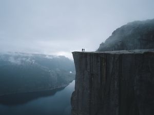 Preview wallpaper silhouettes, rock, cliff, lake, mist