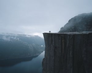 Preview wallpaper silhouettes, rock, cliff, lake, mist