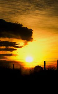 Preview wallpaper silhouettes, sun, clouds, sky, sunset, dark, landscape