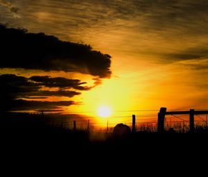 Preview wallpaper silhouettes, sun, clouds, sky, sunset, dark, landscape