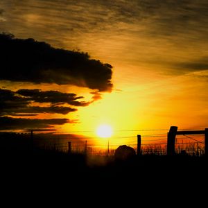 Preview wallpaper silhouettes, sun, clouds, sky, sunset, dark, landscape
