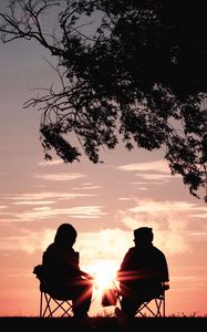 Preview wallpaper silhouettes, sunset, tree, sun, rays