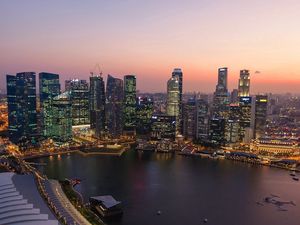 Preview wallpaper singapore, sunset, river, buildings, skyscrapers