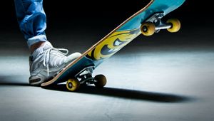 Preview wallpaper skateboard, leg, sneakers, jeans, dark