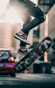 Preview wallpaper skateboard, legs, sneakers, street, rays