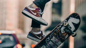 Preview wallpaper skateboard, legs, sneakers, street, rays