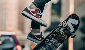 Preview wallpaper skateboard, legs, sneakers, street, rays