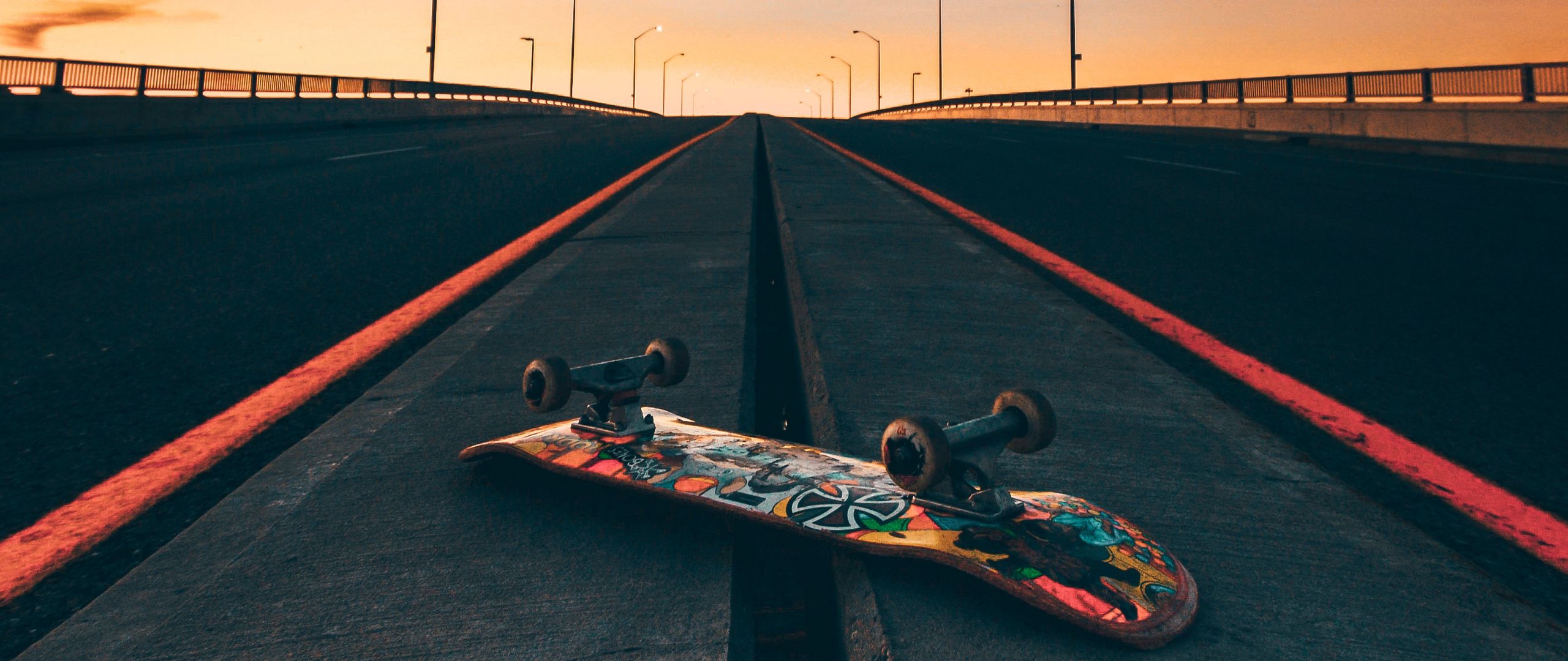 Download wallpaper 2560x1080 skateboard, road, marking, sky dual wide