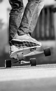 Preview wallpaper skateboard, skate, bw, legs, sneakers