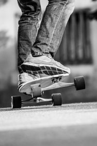 Preview wallpaper skateboard, skate, bw, legs, sneakers