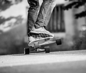 Preview wallpaper skateboard, skate, bw, legs, sneakers