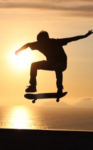 Preview wallpaper skateboard, skate, skater, trick, silhouette, sunset