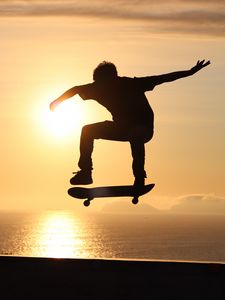 Preview wallpaper skateboard, skate, skater, trick, silhouette, sunset