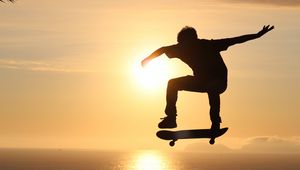 Preview wallpaper skateboard, skate, skater, trick, silhouette, sunset