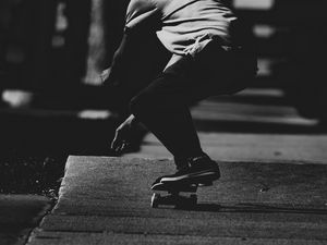 Preview wallpaper skateboard, skateboarder, bw, dark, asphalt