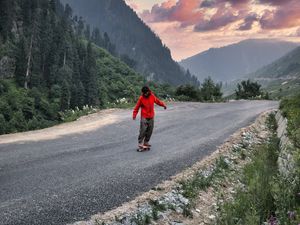 Preview wallpaper skateboard, skater, road, mountains, trees, nature