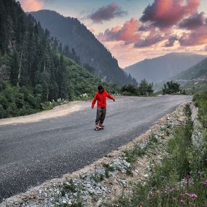 Preview wallpaper skateboard, skater, road, mountains, trees, nature