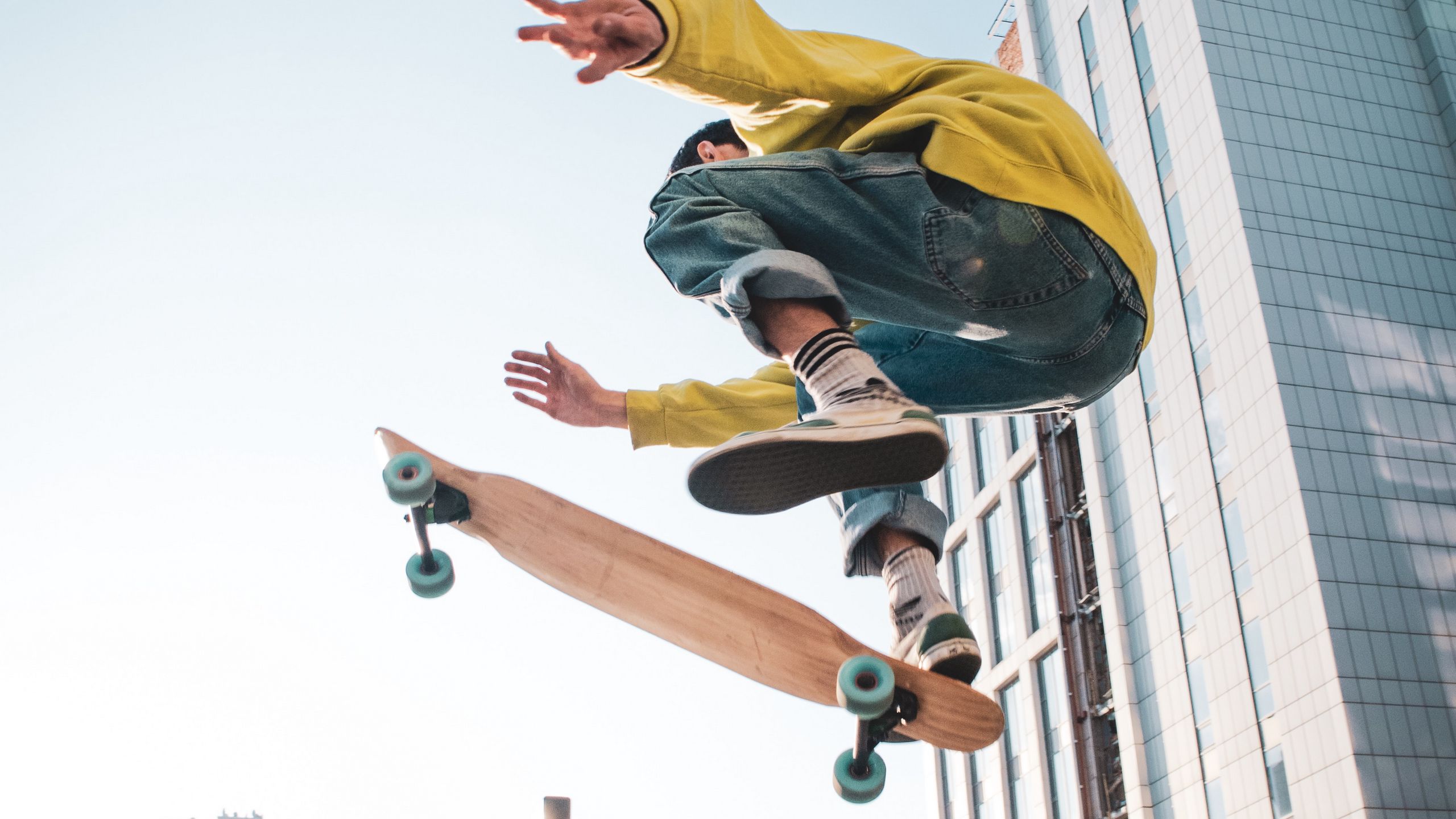 Download wallpaper 2560x1440 skateboarder, skate, jump, trick, city ...