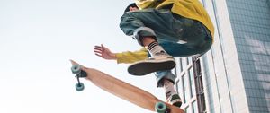 Preview wallpaper skateboarder, skate, jump, trick, city, extreme
