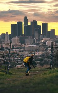 Preview wallpaper skater, skate, city, buildings, view