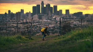 Preview wallpaper skater, skate, city, buildings, view