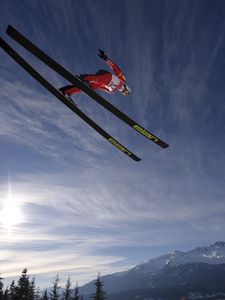 Preview wallpaper skier, ski, jump, fly, sky, sun, mountains
