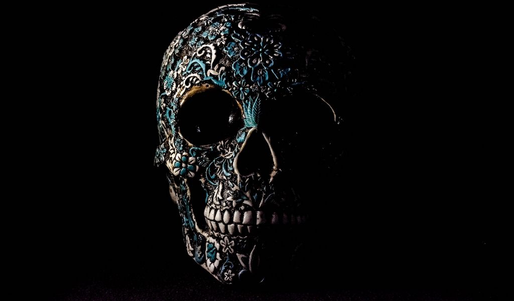 1024x600 Wallpaper skull, dark, patterns, bones