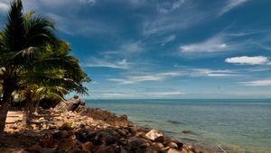 Preview wallpaper sky, beach, palm trees, rocks, landscape, day, thailand