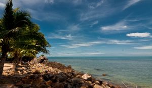 Preview wallpaper sky, beach, palm trees, rocks, landscape, day, thailand