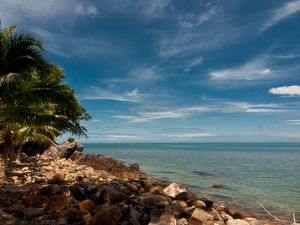 Preview wallpaper sky, beach, palm trees, rocks, landscape, day, thailand