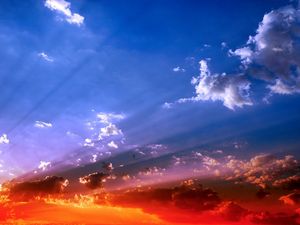 Preview wallpaper sky, beams, sun, light, orange, blue, brightly