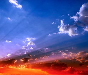 Preview wallpaper sky, beams, sun, light, orange, blue, brightly