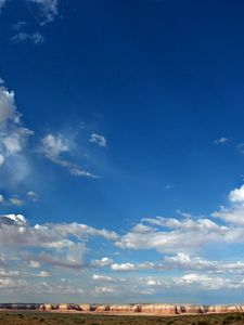 Preview wallpaper sky, clouds, blue, white, canyons, mountains