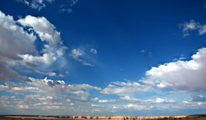 Preview wallpaper sky, clouds, blue, white, canyons, mountains