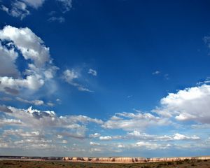 Preview wallpaper sky, clouds, blue, white, canyons, mountains