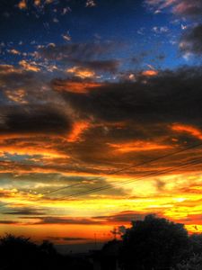 Preview wallpaper sky, clouds, decline, wires, columns, orange