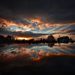 Preview wallpaper sky, evening, decline, darkness, reflection, lake, trees, outlines, surface