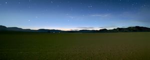 Preview wallpaper sky, field, mountains, starry sky, dark