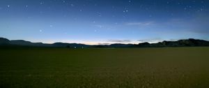 Preview wallpaper sky, field, mountains, starry sky, dark