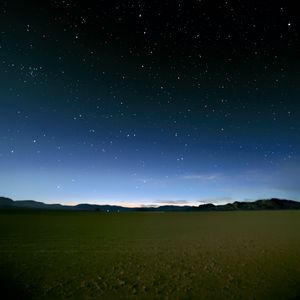 Preview wallpaper sky, field, mountains, starry sky, dark