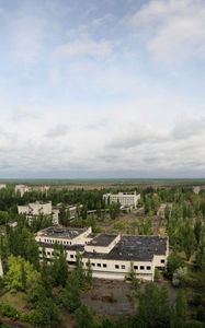 Preview wallpaper sky, roof, apartments, trees, ghost town