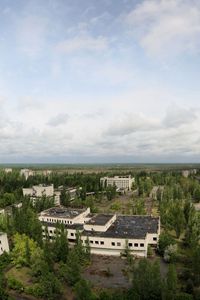 Preview wallpaper sky, roof, apartments, trees, ghost town