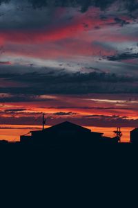 Preview wallpaper sky, sunset, building, cloudy, clouds