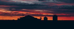 Preview wallpaper sky, sunset, building, cloudy, clouds