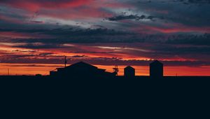 Preview wallpaper sky, sunset, building, cloudy, clouds