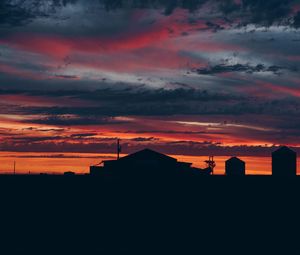 Preview wallpaper sky, sunset, building, cloudy, clouds