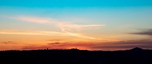 Preview wallpaper sky, sunset, dusk, silhouette, hills