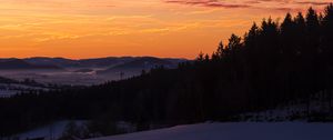 Preview wallpaper sky, trees, dawn, snow, clouds